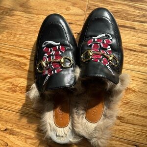 Gucci black, fur lined sneak Mules.